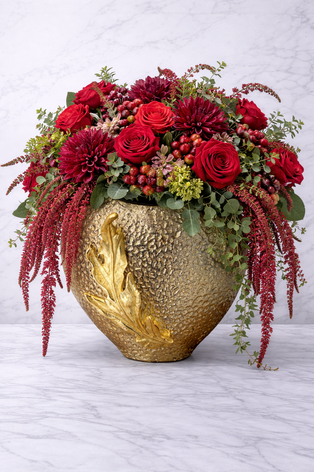 Guycollection gold metal vase with textured finish and leaf accent luxury home decor