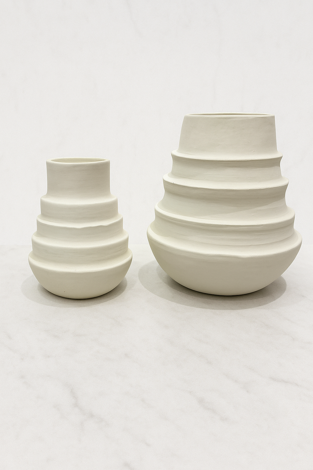 White ceramic tiered Ringlet vase modern minimalist neutral home decor on textured background
