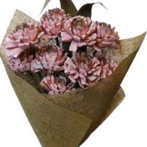 Coral pink folded rose with leaves